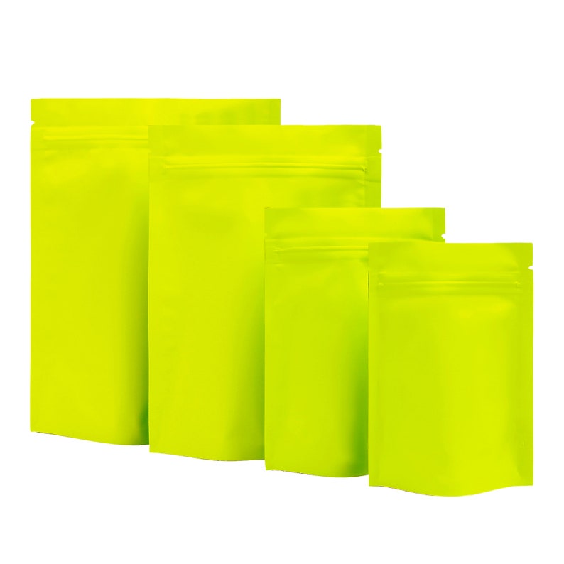 May include: Four different sizes of bright green stand-up pouches with zipper closures. The pouches are made of a shiny, metallic material.