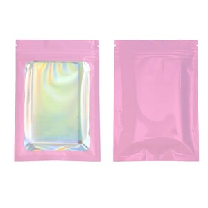 May include: Two pink stand-up pouches, one with a clear iridescent window and one without.