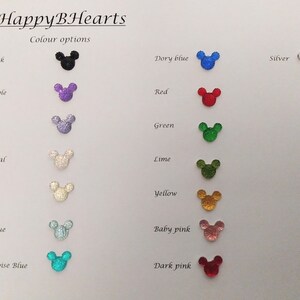 May include: A chart showing different color options for a product. The color options are displayed as small, sparkly Mickey Mouse ears in various colors, including black, purple, lilac, crystal, clear, sky blue, turquoise blue, dory blue, red, green, lime, yellow, baby pink, and dark pink.