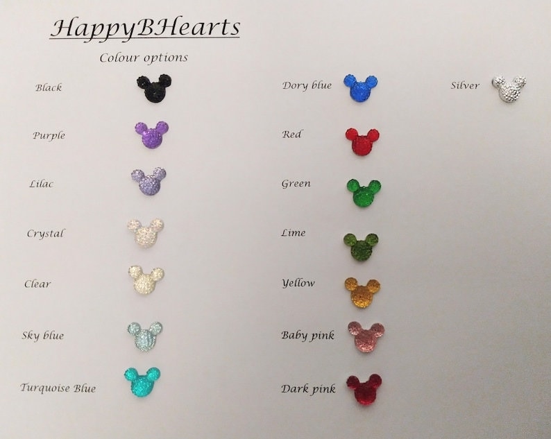 May include: A chart showing different color options for a product. The color options are displayed as small, sparkly Mickey Mouse ears in various colors, including black, purple, lilac, crystal, clear, sky blue, turquoise blue, dory blue, red, green, lime, yellow, baby pink, and dark pink.