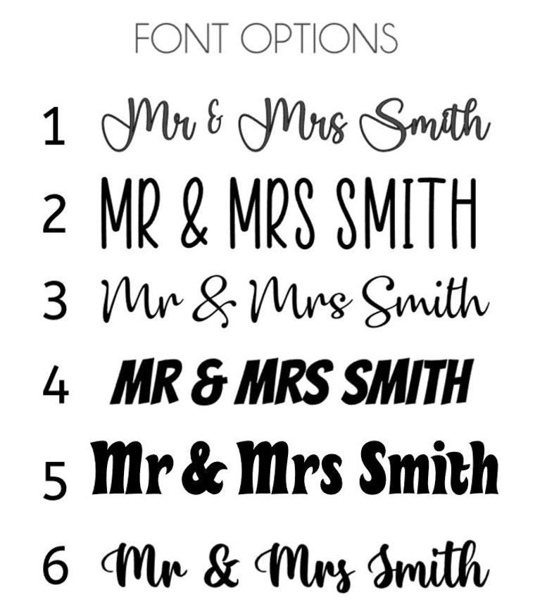 May include: A white background displays six font options for the names "Mr & Mrs Smith". The text is in black, with varying styles including cursive, bold, and all caps. The words "FONT OPTIONS" are at the top.