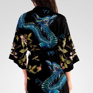 May include: Black silk robe with a blue and green dragon print and floral accents.