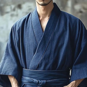 May include: A dark blue traditional Japanese robe with a long sleeve and a sash tied at the waist.
