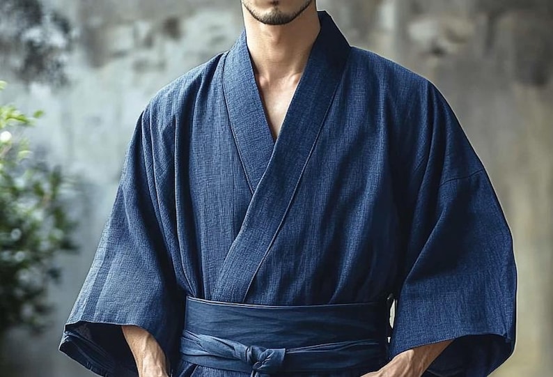 May include: A dark blue traditional Japanese robe with a long sleeve and a sash tied at the waist.