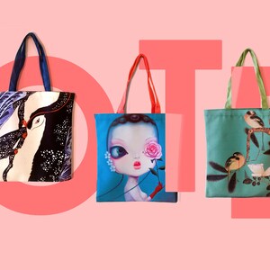 May include: Five different tote bags with various colorful designs. The bags are made of canvas and have a simple design with two handles. The designs include a blue and white wave pattern, a black and white bird pattern, a blue and pink doll pattern, a green and brown bird pattern, and a red and black doll pattern.