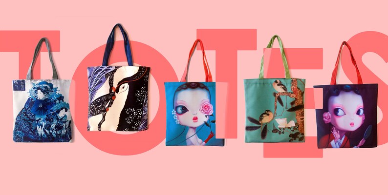 May include: Five different tote bags with various colorful designs. The bags are made of canvas and have a simple design with two handles. The designs include a blue and white wave pattern, a black and white bird pattern, a blue and pink doll pattern, a green and brown bird pattern, and a red and black doll pattern.