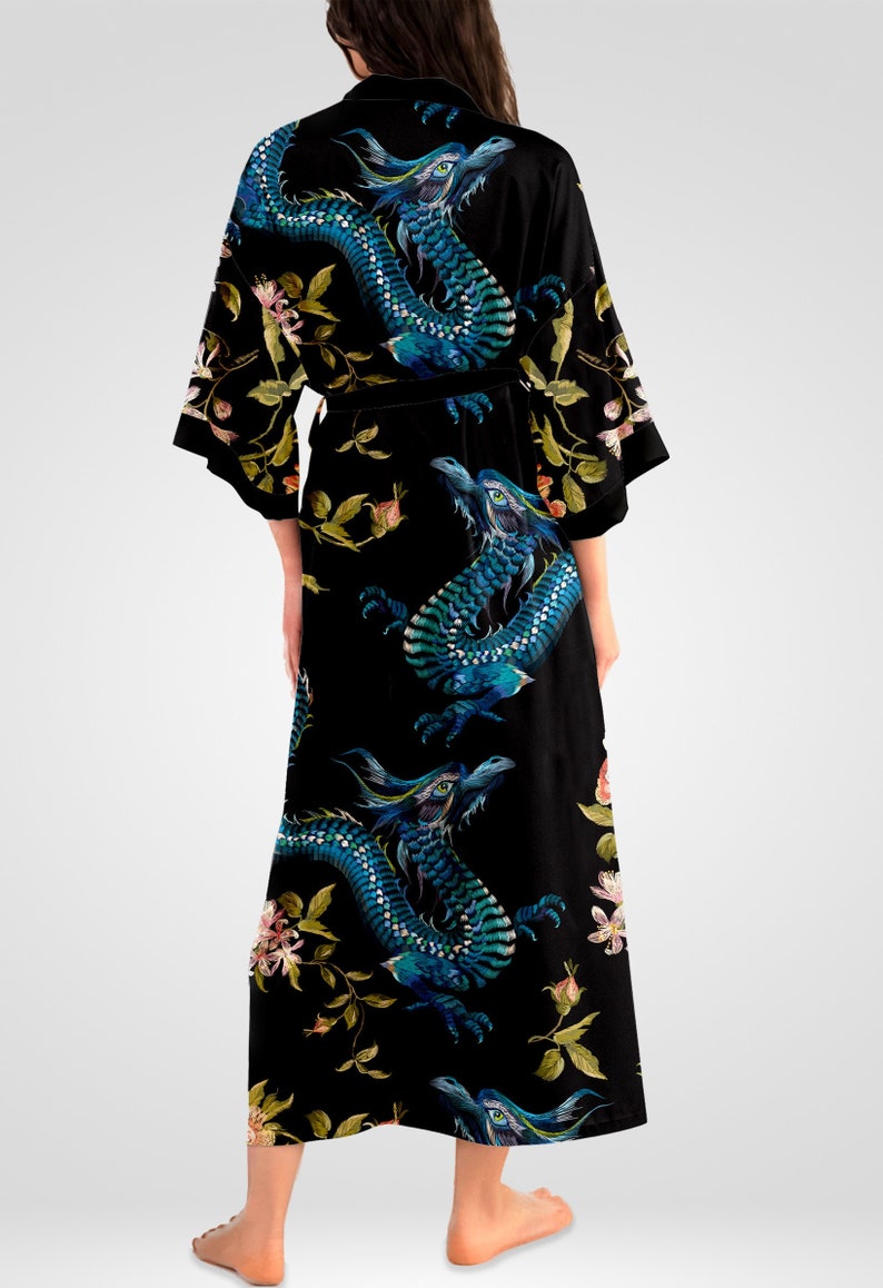 May include: Black silk robe with a blue and green dragon print and floral accents.