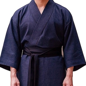 May include: A dark blue, long-sleeved robe with a black sash tied at the waist. The robe has a traditional Japanese style.