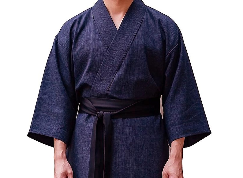 May include: A dark blue, long-sleeved robe with a black sash tied at the waist. The robe has a traditional Japanese style.