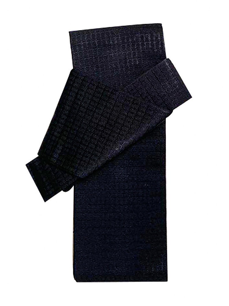 May include: A dark blue, waffle-textured fabric folded in half. The fabric is folded in a way that shows the texture of the fabric.