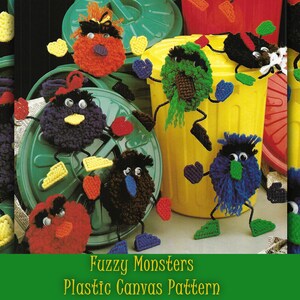 May include: Fuzzy Monsters Plastic Canvas Pattern. A craft project featuring six colorful, fuzzy monsters with googly eyes and pipe cleaner legs. The monsters are sitting on top of green and yellow trash cans.