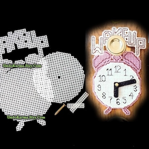 May include: A plastic canvas craft kit for an alarm clock with the text WAKE UP. The kit includes white grid sheets, a gold-colored fastener, and a finished pink and white alarm clock with black hands showing the time at approximately 3:15.