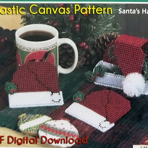 May include: Plastic canvas pattern for a Santa hat. The pattern shows three red and white Santa hats with white trim and holly accents. The pattern is a digital download.