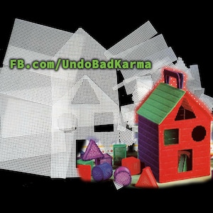 May include: A colorful plastic house with a green roof, red walls, and purple trim, surrounded by white plastic mesh pieces. Various geometric shapes in red, purple, and green are scattered around the house. Text on the image reads "FB.com/UndoBadKarma".