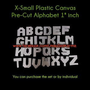May include: White plastic canvas letters of the alphabet, pre-cut for crafting projects. Each letter is 1 inch in size. The letters are arranged in alphabetical order. The text "www.facebook.com/UndoBadkarma" is visible below the letters.
