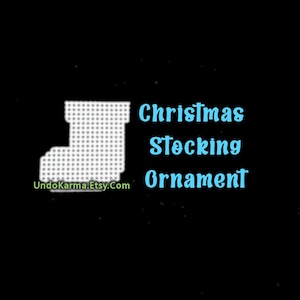 May include: A white plastic canvas grid shaped like a Christmas stocking. The text "Christmas Stocking Ornament" appears in light blue, and the text "UndoKarma.Etsy.Com" appears in green against a solid black background.