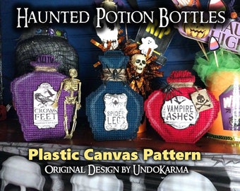 May include: Three plastic canvas potion bottles with labels that read "Crow's Feet", "Spider Legs", and "Vampire Ashes". The bottles are purple, blue, and red and are decorated with Halloween-themed embellishments. The bottles are on a wooden surface with a sign that reads "Haunted Potion Bottles" and "Plastic Canvas Pattern".