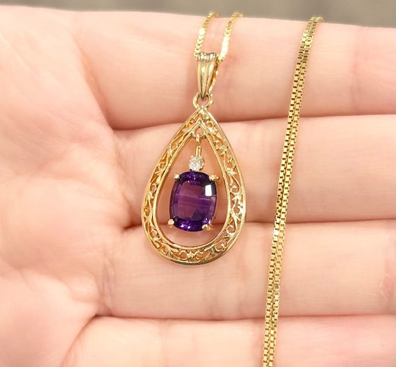 Sterling Silver Amethyst And White Topaz Oval Filigree Teardrop Pendant Sterling Silver Amethyst And White Topaz Oval Filigree Teardrop Pendant