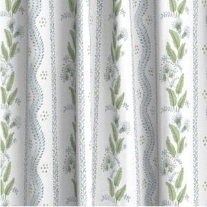 May include: White fabric with a repeating pattern of green and blue floral sprigs. The pattern is vertical and includes small dots.