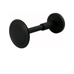 May include: A black curtain tieback with a circular design. The tieback features a round, decorative front piece and a matching back plate, connected by a straight rod. The hardware is a matte black finish.