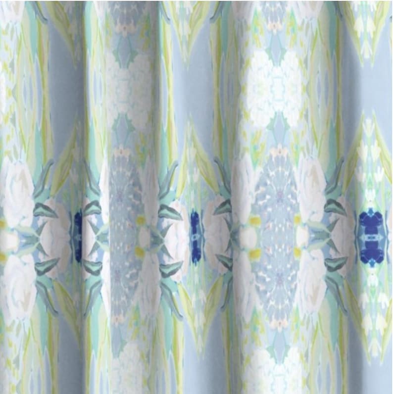 May include: A blue and white patterned fabric with a floral design. The fabric has a soft, flowing texture and is perfect for curtains, upholstery, or other home decor projects.