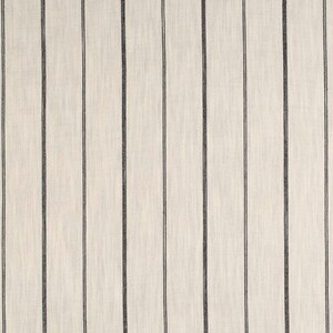 May include: A close-up of a white fabric with thin black stripes. The fabric has a subtle texture.