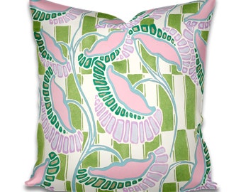 May include: A square throw pillow featuring a repeating pattern of stylized pink and light purple flowers with green and gold accents. The background consists of a white and green checkered grid design with vertical stripes throughout the fabric.