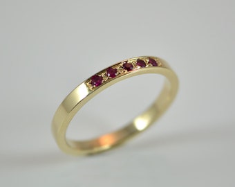 Delicate gold ring with rubies