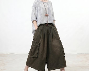 Pantalones cargo de mezclilla desgastada, jeans anchos cropped con lavado vintage, culottes utilitarios extragrandes, estilo casual boho streetwear, ajuste holgado
