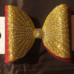 Gold and red dolly bow