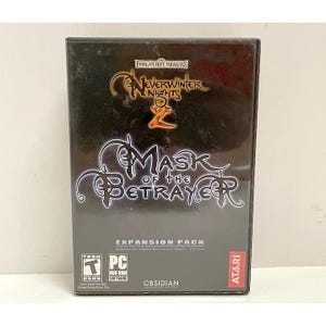 May include: A DVD-ROM game case for "Neverwinter Nights 2: Mask of the Betrayer." The case is black with gold and white lettering. The game is an expansion pack for PC. The Atari and Obsidian logos are visible.