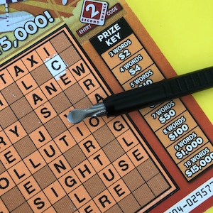 Lottery card scratching tool