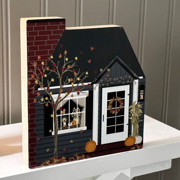 Estantería de colores otoñales: decoración otoñal en tonos azul y gris de Pat Isaac