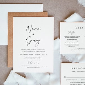May include: Wedding invitation suite with a white background and black text. The invitation features the couple's names, "Narmi + Gurge", the date and time of the wedding, and the location. The RSVP card includes the couple's names, the date by which to RSVP, and a list of meal options.