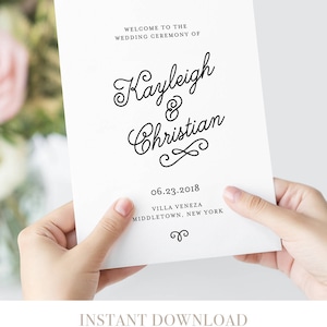 May include: A white wedding ceremony program with black text. The text reads "Welcome to the Wedding Ceremony of Kayleigh & Christian" with the date "06.23.2018" and the location "Villa Veneza, Middletown, New York".