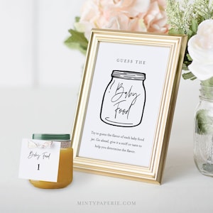 Puede incluir: Una tarjeta de juego de baby shower imprimible con una ilustración en blanco y negro de un tarro de comida para bebés. El texto "Adivina la comida para bebés" está en la parte superior de la tarjeta. El texto debajo de la ilustración dice: "Intenta adivinar el sabor de cada tarro de comida para bebés. Adelante, huele o prueba para ayudarte a determinar el sabor."