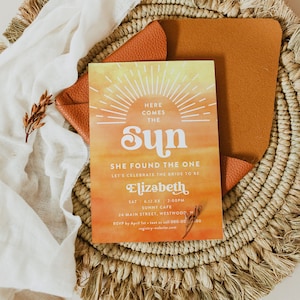 May include: A sunset-themed bridal shower invitation with the text "Here comes the sun" and "She found the one" in a retro font. The invitation is for Elizabeth and includes the date, time, and location of the event. RSVP information is also included.