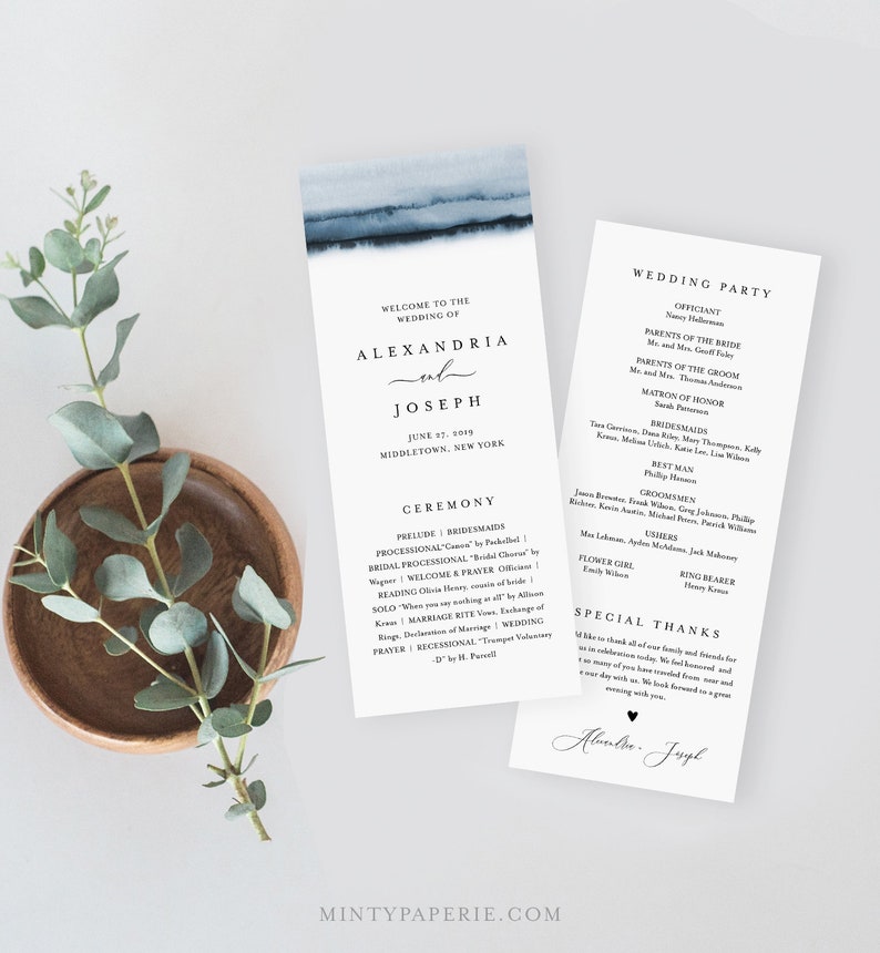 May include: Wedding program with a blue watercolour design. The program features the names Alexandria and Joseph, the wedding date, and ceremony details. A separate card lists the wedding party.