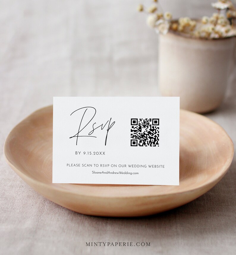 May include: A white RSVP card with black text and a black and white QR code. The text reads "RSVP BY 9.15.20XX PLEASE SCAN TO RSVP ON OUR WEDDING WEBSITE SloaneAndAndrewWedding.com"