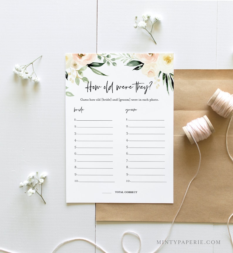 May include: A printable bridal shower game with a floral design. The game asks guests to guess the ages of the bride and groom in photos. The text on the game says "How old were they?" and "Guess how old [bride] and [groom] were in each photo."