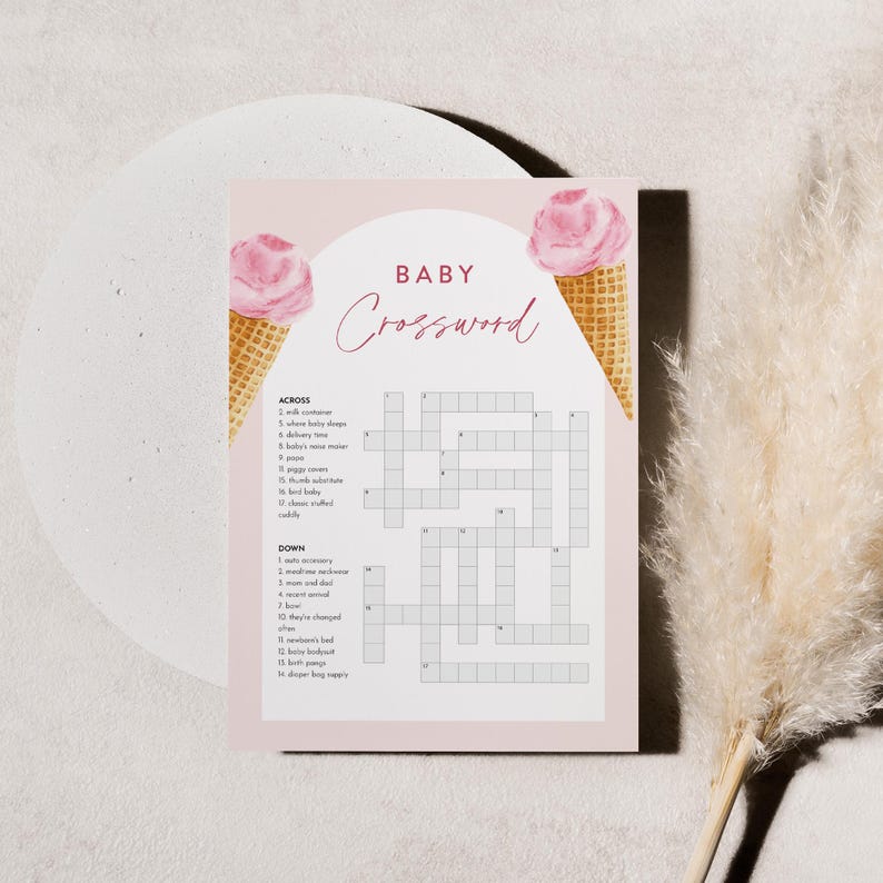Puede incluir: Un crucigrama de baby shower rosa y blanco con una ilustraci&oacute;n de cono de helado rosa y blanco a cada lado. El crucigrama tiene el t&iacute;tulo "Baby Crossword" e incluye pistas para palabras relacionadas con beb&eacute;s.