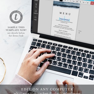 May include: A laptop computer with a white keyboard and a screen displaying a menu template. The menu template has a blue watercolor background and text that reads "MENU" and lists different courses. The text "EDIT ON ANY COMPUTER" is displayed below the laptop.