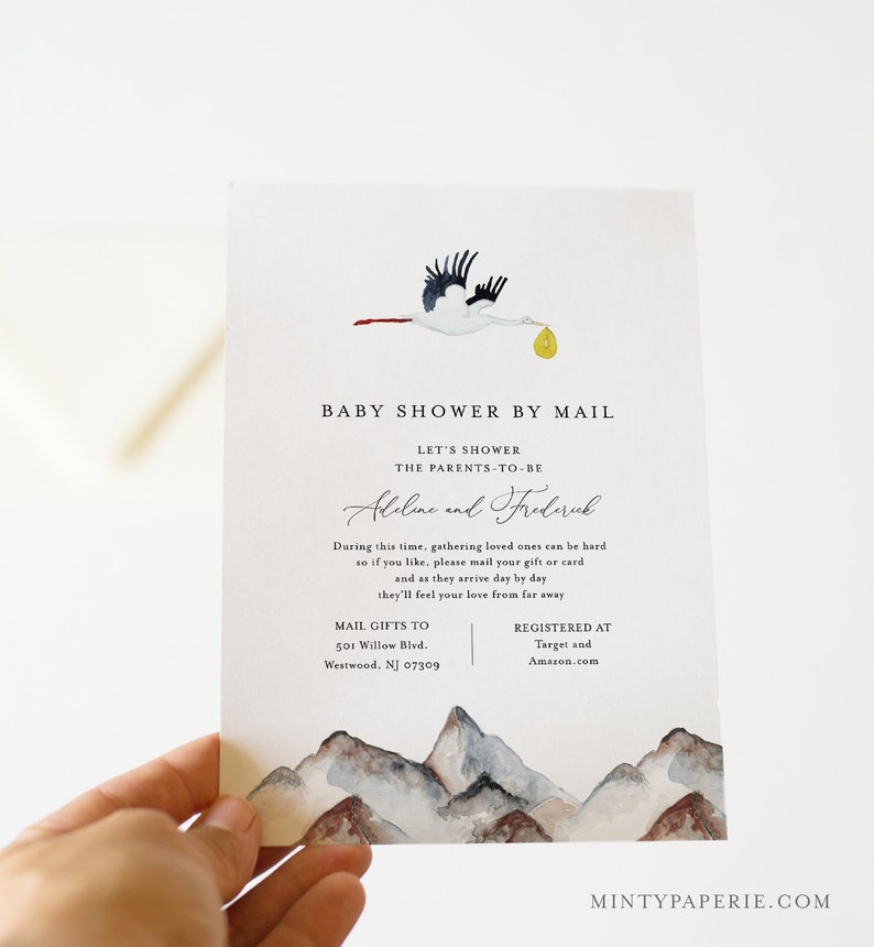 May include: A baby shower by mail invitation with a watercolor illustration of a stork carrying a yellow package over a mountain range. The invitation includes the text "Baby Shower by Mail", "Let's Shower the Parents-to-be", "Abeline and Frederick", "Mail Gifts to 501 Willow Blvd. Westwood, NJ 07309", and "Registered at Target and Amazon.com".