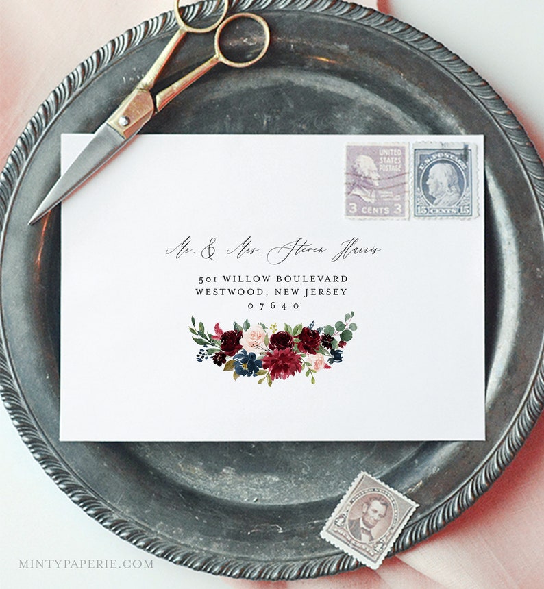 May include: A white envelope with a burgundy floral design and the text "Mr. & Mrs. Steven Haus" and "501 Willow Boulevard, Westwood, New Jersey 07640".