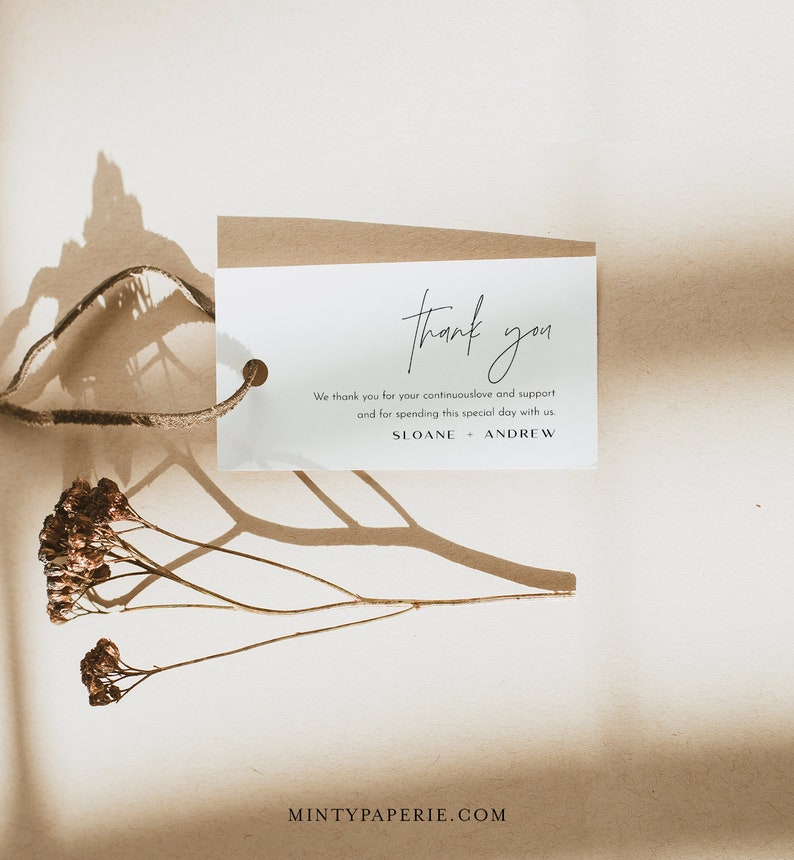 May include: A white thank you tag with brown twine attached. The tag has the text "thank you" in cursive script and the message "We thank you for your continuous love and support and for spending this special day with us. SLOANE + ANDREW".