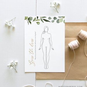 May include: A printable bridal shower game with a simple line drawing of a woman in a dress. The text "Guess the dress" is written in gold script. The background is white with a green watercolor border.