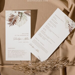 May include: Wedding ceremony program with a tropical theme. The program features a watercolor illustration of palm leaves and flowers in shades of brown, green, and white. The text includes the names Penelope and Nolan, the date of the wedding, and the wedding party.