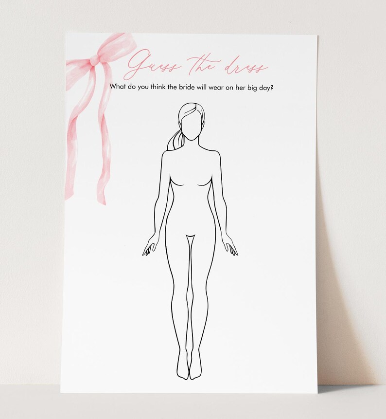 May include: A white paper with the text "Guess the dress" and "What do you think the bride will wear on her big day?" in pink script. A line drawing of a woman is in the center. A pink bow and ribbons are in the upper left corner.