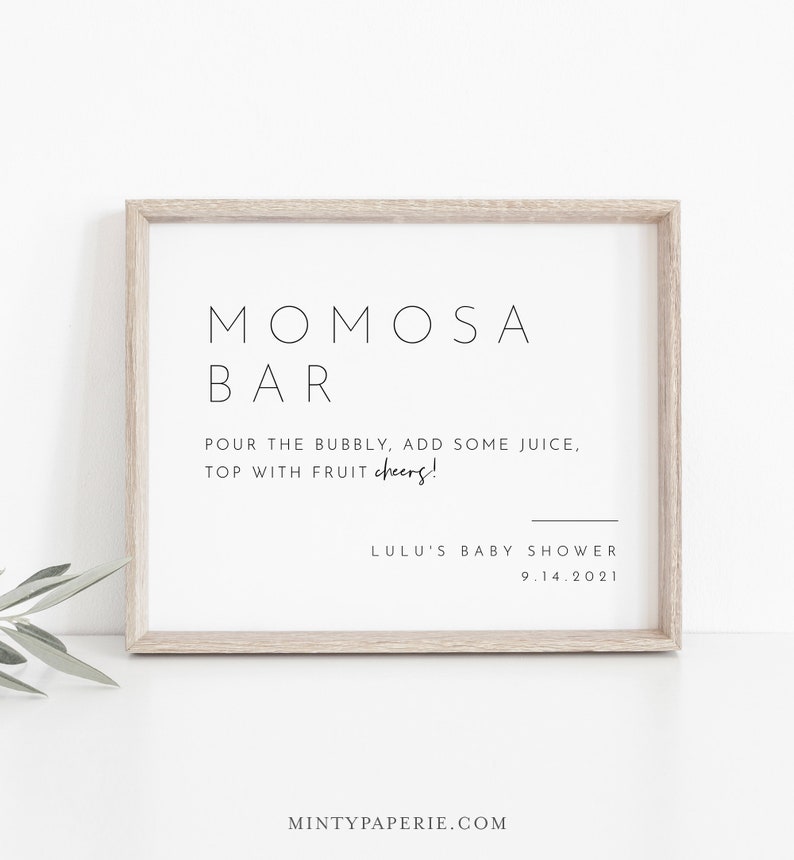 May include: A framed sign with the text "MOMOSA BAR" and instructions for making a mimosa. The sign also includes the text "LULU'S BABY SHOWER 9.14.2021".