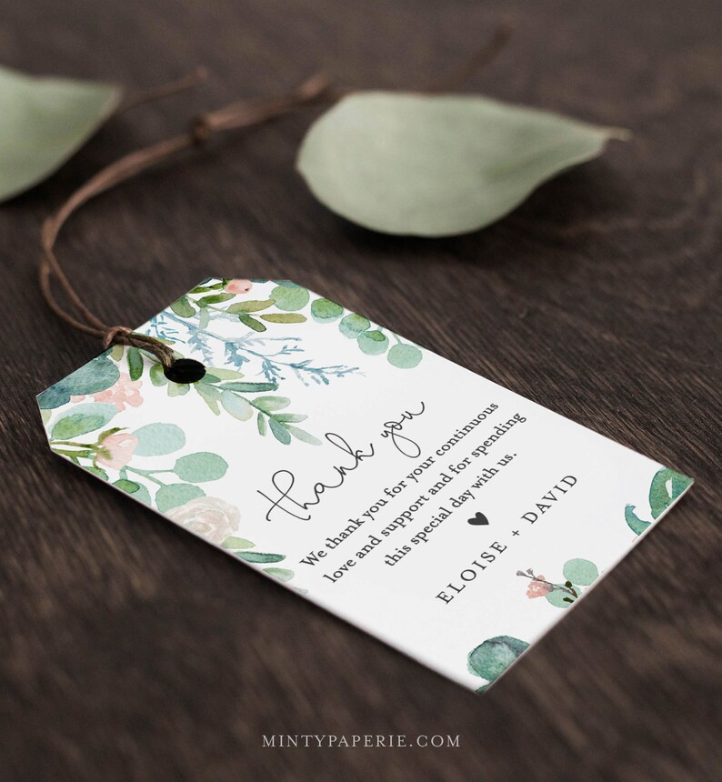 May include: A white thank you tag with a watercolor floral design in shades of green and pink. The text reads "Thank you. We thank you for your continuous love and support and for spending this special day with us. Eloise + David".
